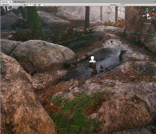 A stony forest floor in the Scene view, with a rectangular area representing a Decal Projector above a reflective puddle.