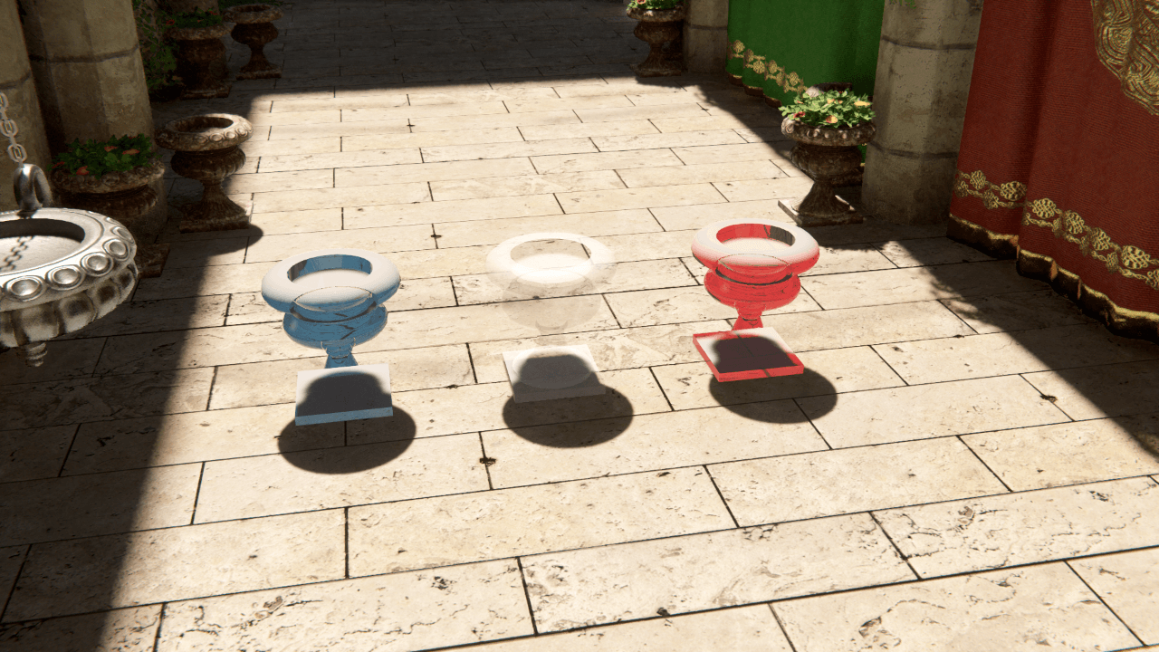Three different colored GameObjects with ray traced Directional Light shadows. All the shadows are the same color.