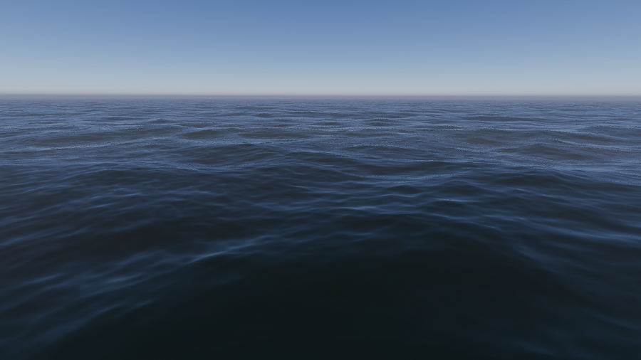 An ocean on a clear day, with large wide waves and peaks.