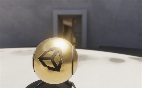 A courtyard with the camera close-up on a golden orb with the Unity logo. The orb is sharp but the background is blurry.