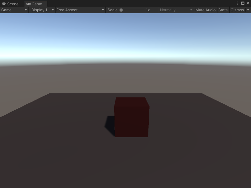 An image of the Game view, that displays a simple scene with a plane and a cube GameObject.