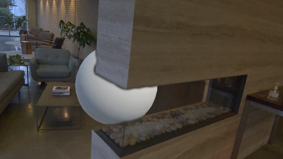 Screenshot from a Meta Quest 3 headset shows a simple app that renders a sphere in a room